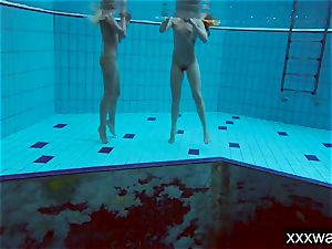 warm Russian femmes swimming in the pool