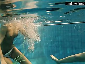 two uber-sexy amateurs showcasing their bodies off under water